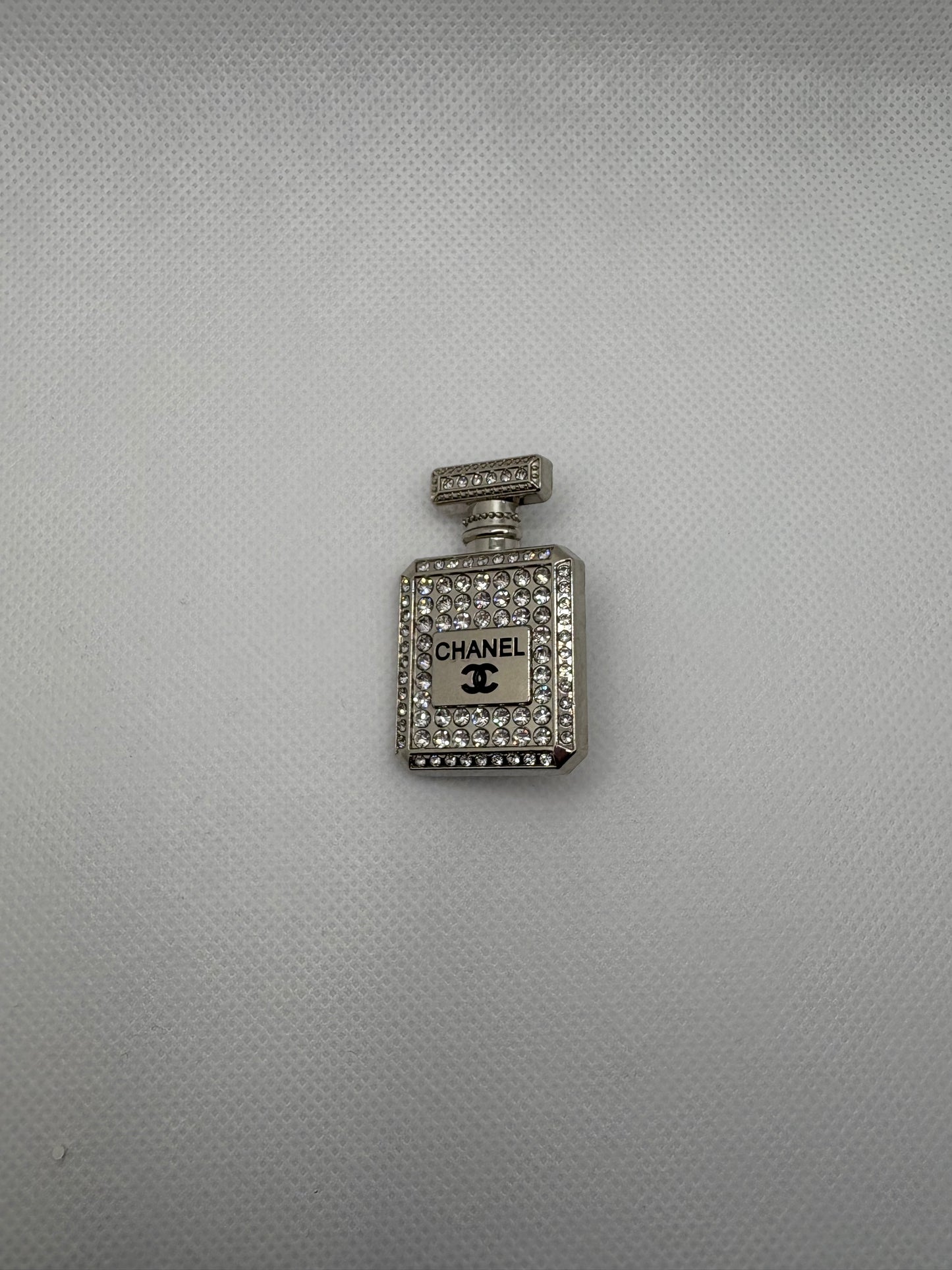 Double c bottle brooch